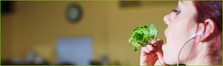 girl eating salad in the gym